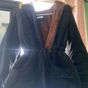 Big winter coat thigh length .